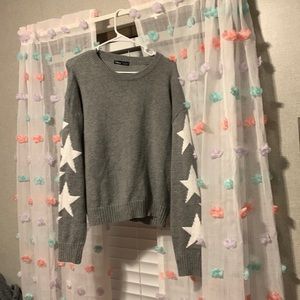 Grey sweater with white stars. Size large.
